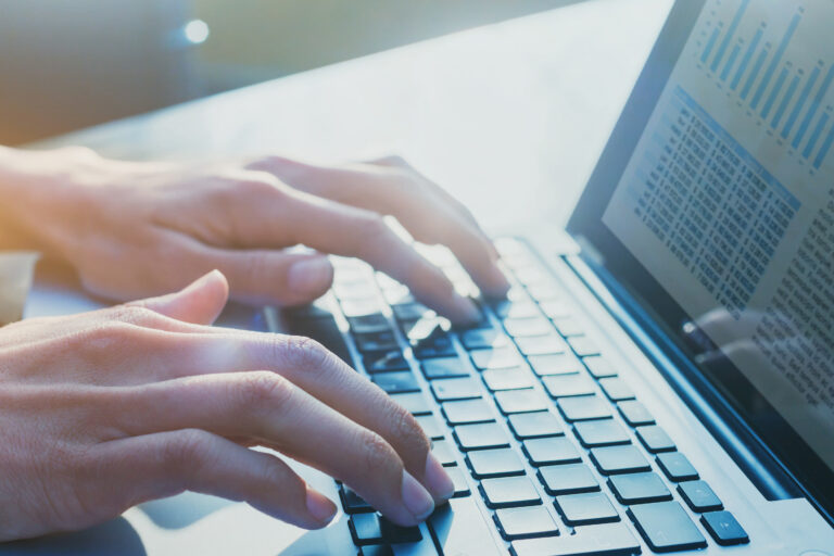 person typing on a keyboard